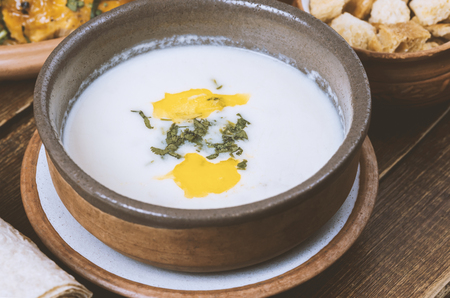 Close-up traditional soup served in clay crockery, different type of bread in Middle Eastern restaurantの写真素材