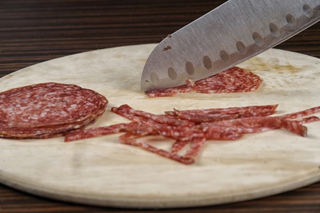 Tasty salami on the tableの写真素材