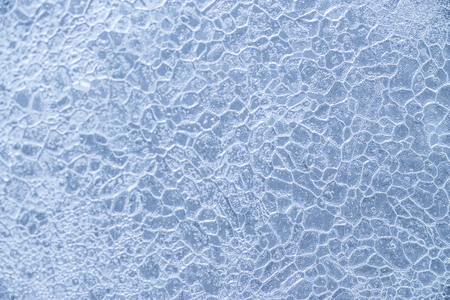 Textured ice blue frozen rink winter background