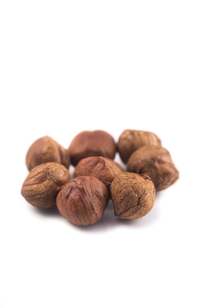 peeled hazelnuts isolated on white background, macro imageの写真素材