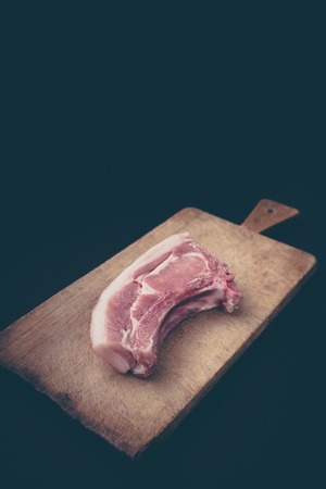 Raw steak  with over rustic wooden board.の写真素材