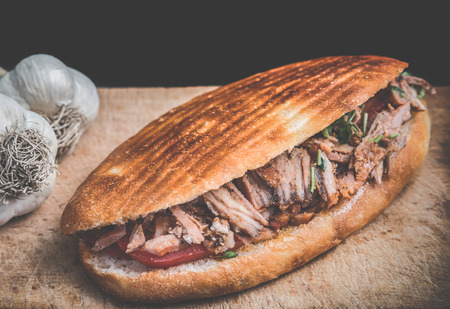 Doner Kebab Gyros Shawarma beef or chiken roll in pitta bread Wrap sandwich on wooden background