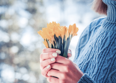 Woman hold bouquet of yellow flowersの写真素材