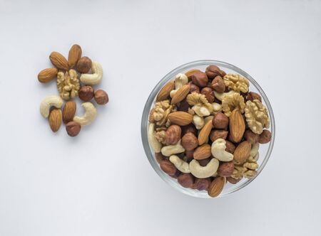 Assorted nuts in a glass bowl.Top view and copy spaceの写真素材