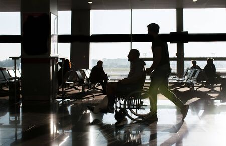 Silhouettes of passengers at the airport. travel conceptの写真素材