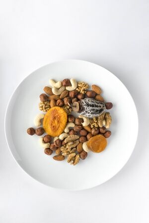 Different kinds of nuts and dry fruits in a plate.の写真素材