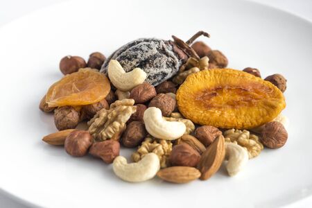 Different kinds of nuts and dry fruits in a plate.の写真素材
