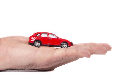 Time-worn car.Car (automobile) insurance and collision damage waiver concepts. Businessman with protective gestureの写真素材