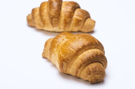 Two fresh croissants on whiteの写真素材