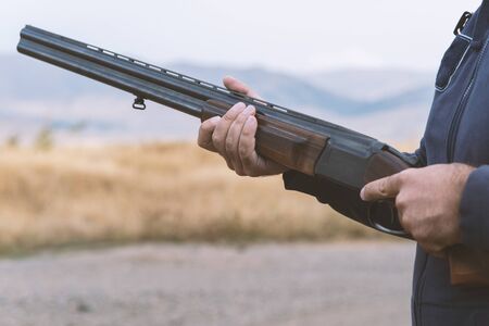 Male hunter ready to hunt with hunting rifle.hunter Holds a rifle.の写真素材