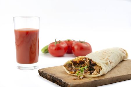 shawarma, tomatoes and tomato juice on a white background.doner kebabの写真素材