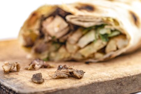 Doner Kebab Gyros Shawarma beef or chiken roll in pitta bread  sandwich on wooden deskの写真素材