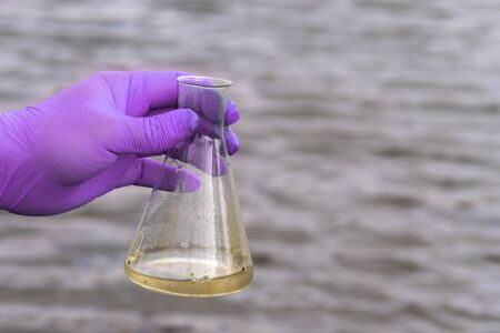Sample water from the river for analysis.の写真素材