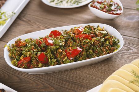 oriental tabbouleh salad on a wooden tableの写真素材
