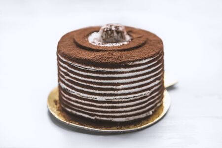 sponge cake with coffee filling on white background.  Sweet food. Sweet dessert.Chocolate Cake