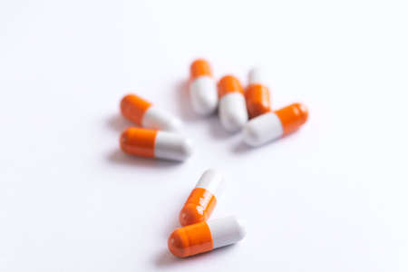 Drug prescription for treatment medication. Pharmaceutical medicament, Pharmacy theme, Heap of orange white medicamentの写真素材