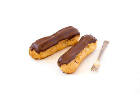 Traditional french dessert.Two eclairs on white background. Sweet pastry products