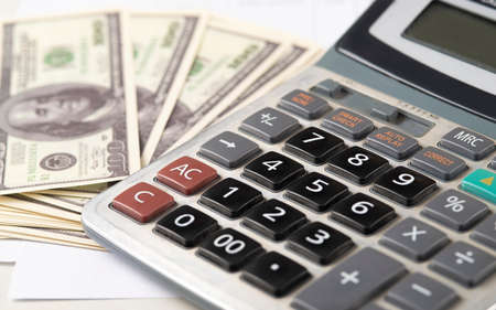 Money dollars and calculator, economy concept, money distribution. Euro. The crisis after the covid-19 pandemic. The dollar is falling or rising.の写真素材