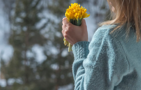 Woman hold bouquet of yellow flowersの写真素材