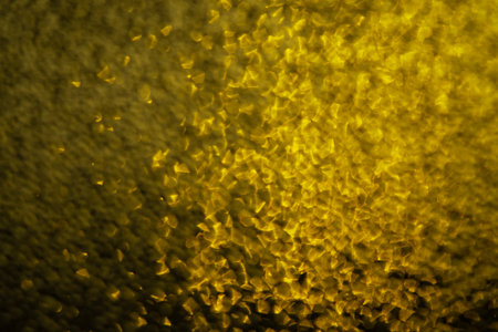 Gold bokeh abstract texture background. Seamless gold patternの写真素材