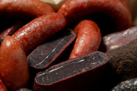 Cold meats, smoked and cured sausage, smoked meat, sausage in wooden box. rustic style.の写真素材