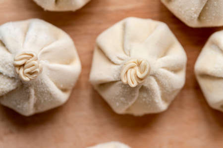 Close up of frozen uncooked khinkali - Georgian dumplings