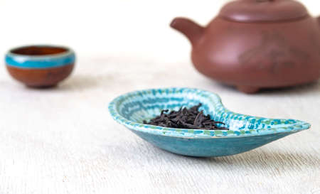 black tea, traditional eastern teapot on white wooden deskの写真素材