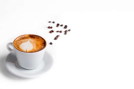 Latte coffee in white coffee cup with plate on white background. cappuccino coffeeの写真素材
