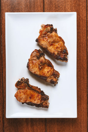 delicious grilled pork steaks on a white plateの写真素材