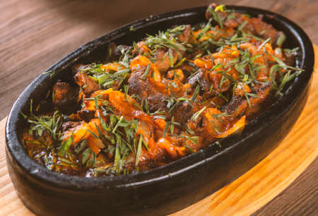 Korean spicy food on a plate,meat with vegetables and onionの写真素材