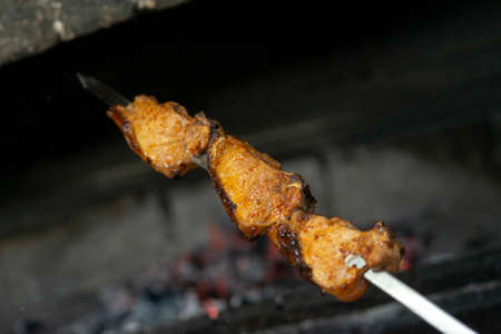 Caucasian bbq with meat on a skewer. pork shish kebab