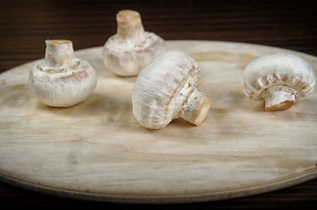 white fresh mushrooms on the table