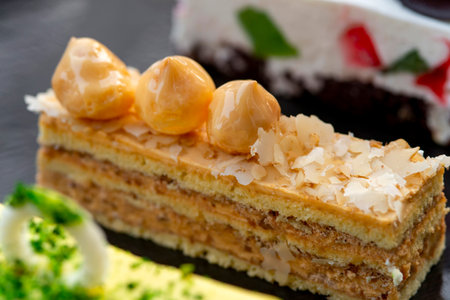 Set of tasty elegant desserts served on silver platterの写真素材