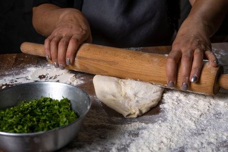 chef making dough with flour and herbs