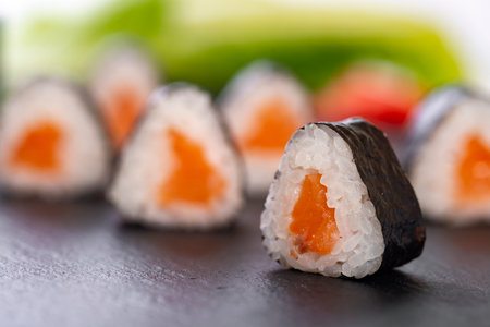 sushi roll with salmon and avocado on a white backgroundの写真素材