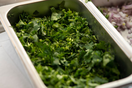 Sliced parsley in iron bowl, closeupの写真素材