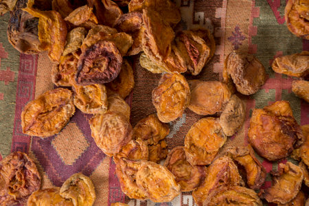 close-up shot of dried apples on rustic clothの写真素材