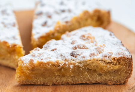 Three pieces of pie in wooden desk on white backgroundの写真素材