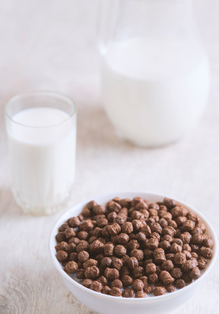 Breakfast: chocolate balls, fresh cows milk, selective focusの写真素材