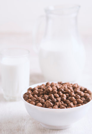 Breakfast: chocolate balls, fresh cows milk, selective focusの写真素材