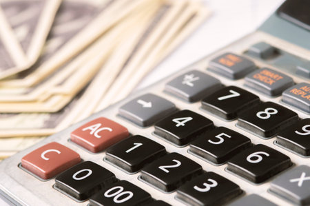Money dollars and calculator, economy concept, money distribution. Euro. The crisis after the covid-19 pandemic. The dollar is falling or rising.の写真素材