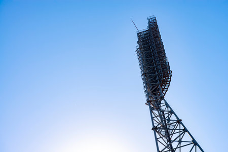 Sports stadium lighting system on a clear blue sky day. stadium lights