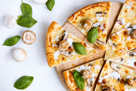 Tasty fresh baked pizza with champignons and chicken filletの写真素材