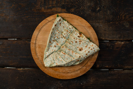 traditional pie with herbs and cheese on wooden board.jingyalの写真素材