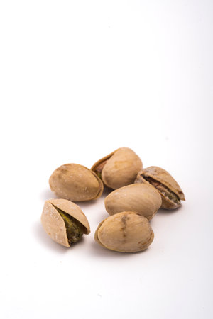 Pistachios nuts over white background. Healthy food concept.の写真素材