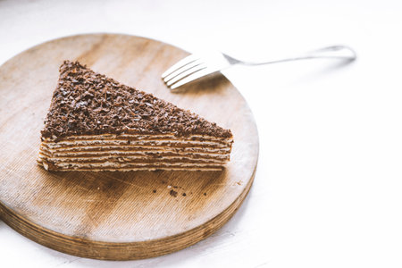 delicious chocolate cake on a wooden stand