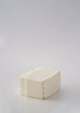 Piece of feta cheese isolated on a white background.の写真素材