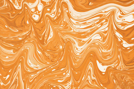 Abstract background of acrylic paint in yellow tones. Liquid marble texture.の素材
