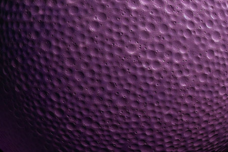 abstract background with holes in a purple plastic ball. close-upの素材