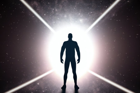 Silhouette of a man standing in front of a luminous portalの素材